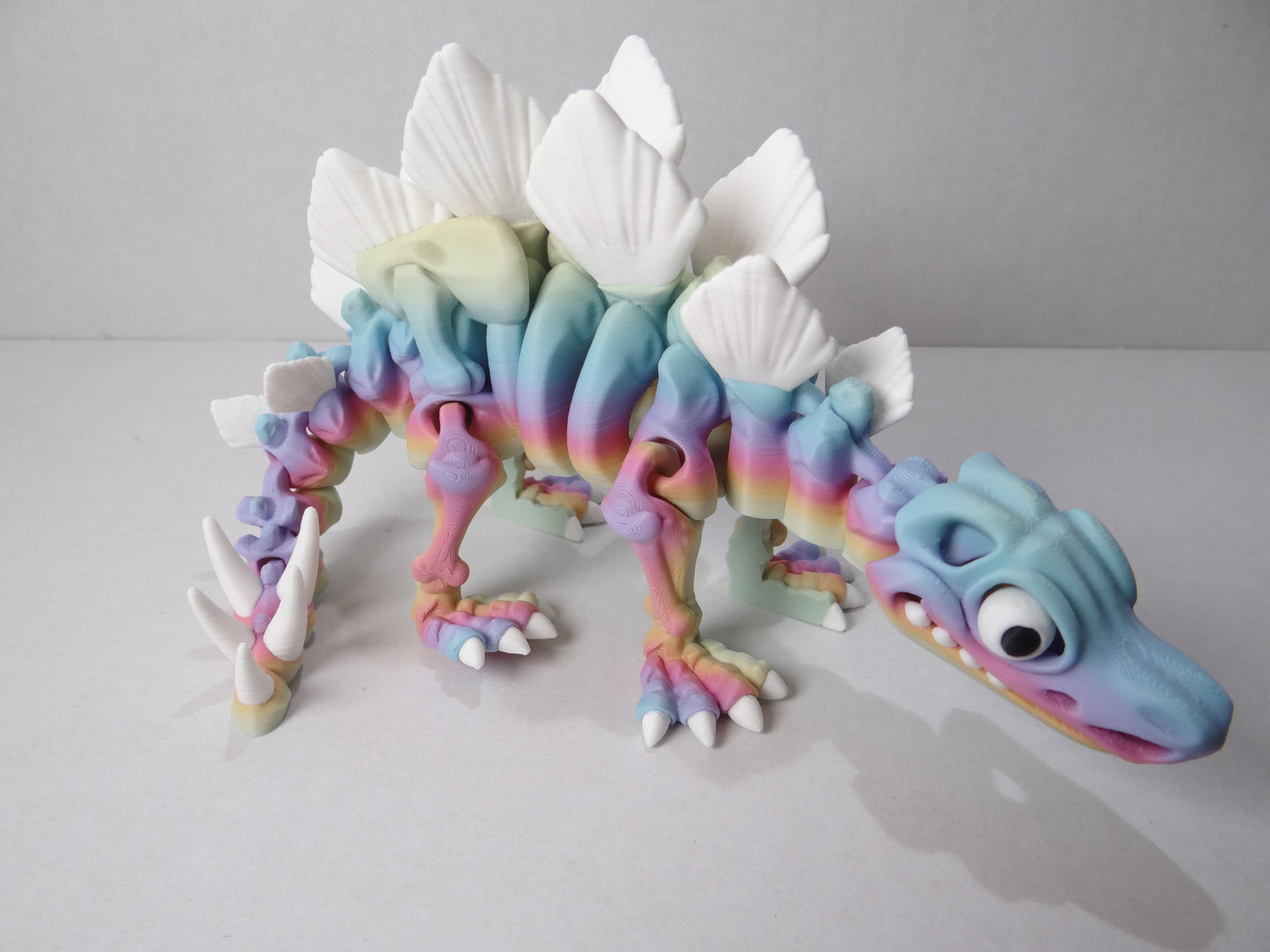 3D Printed Stegosaurus Skeleton – Fully Articulated Dinosaur Model – Glow in Dark, Sparkle Candy, Rainbow