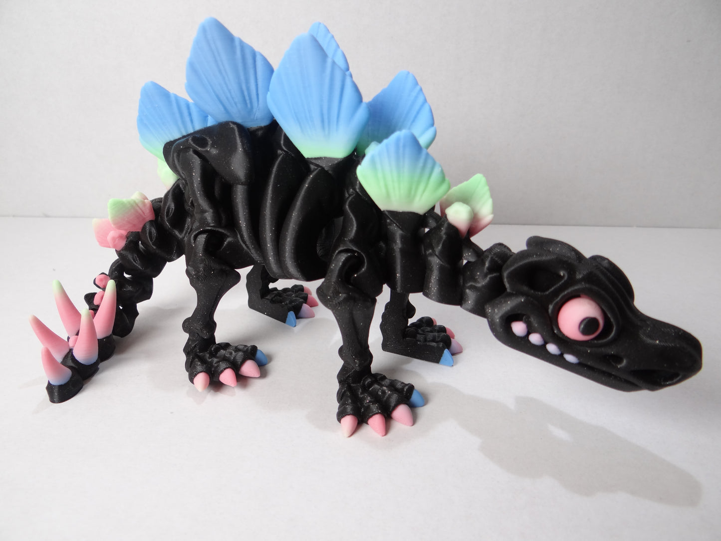 3D Printed Stegosaurus Skeleton – Fully Articulated Dinosaur Model – Glow in Dark, Sparkle Candy, Rainbow