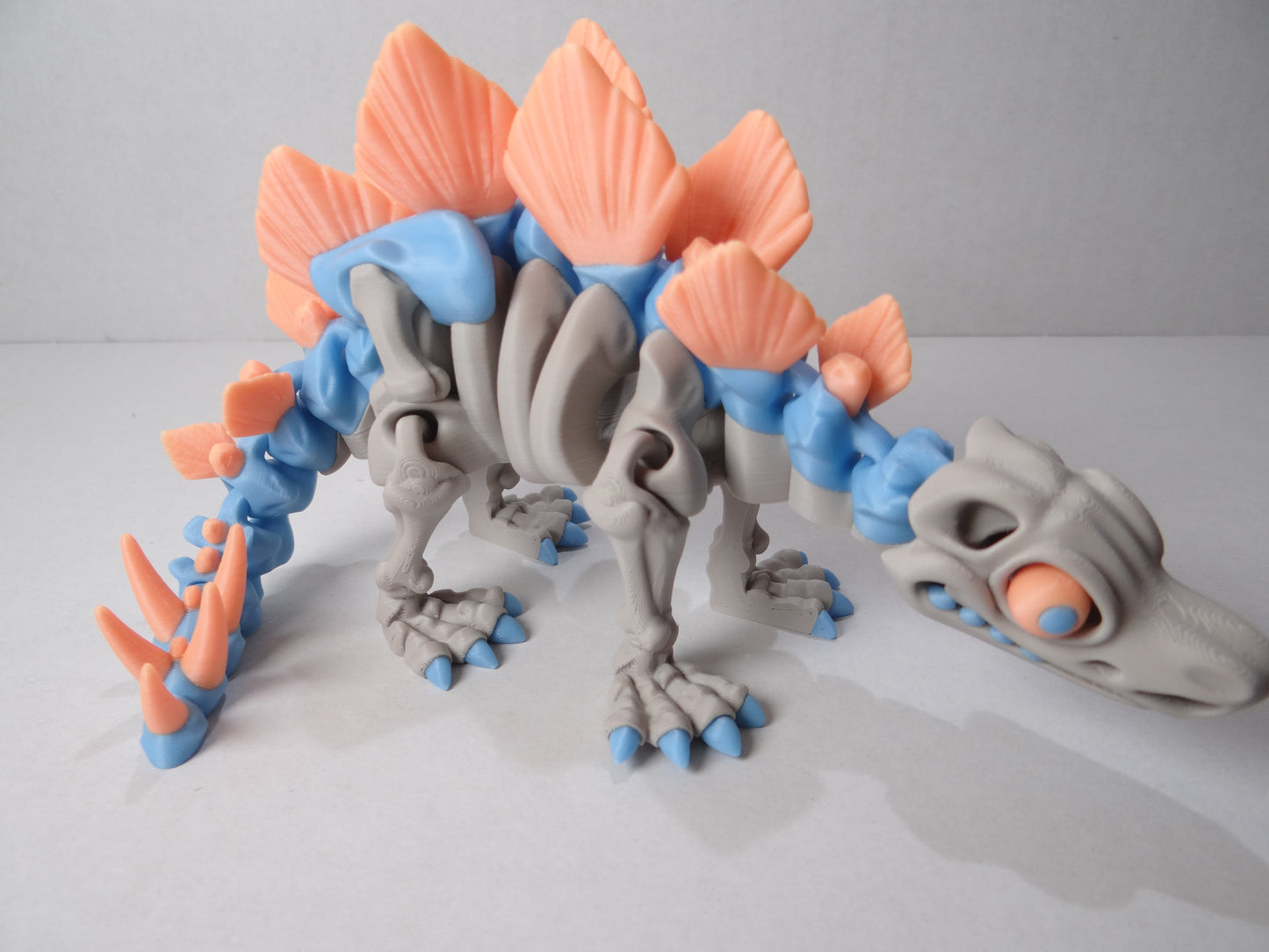 3D Printed Stegosaurus Skeleton – Fully Articulated Dinosaur Model – Glow in Dark, Sparkle Candy, Rainbow