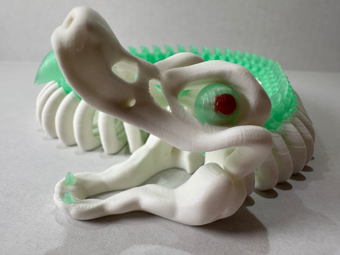 3D Printed Articulating Skeleton Snake – Poseable Serpent Model – Glow in Dark or Rainbow Gradient